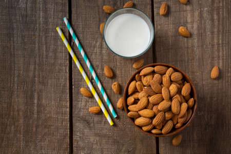 glass of almond milk on wooden surfaceの写真素材