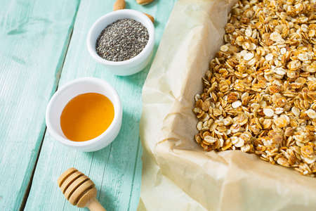 home made granola on turquoise surfaceの写真素材