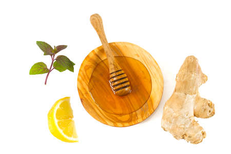 fresh honey and spices isolated on whiteの写真素材