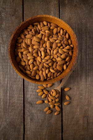 almonds on wooden surfaceの写真素材