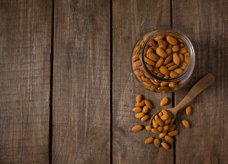 almonds on wooden surfaceの写真素材