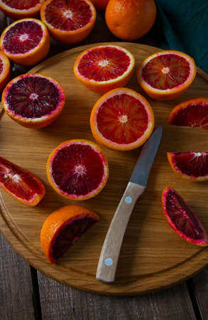 blood orange on wooden surfaceの写真素材