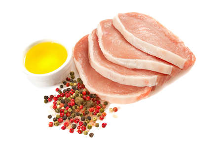 sliced raw meat isolated on whiteの写真素材
