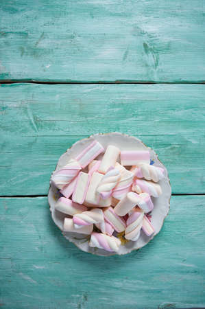 marshmallow on turquoise surfaceの写真素材