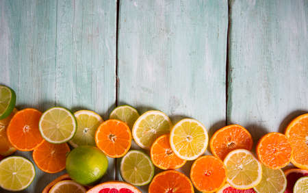 citrus fruit slices on turquoise background