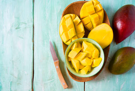 mango fruit on wooden surfaceの写真素材