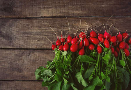 fresh radishes on wooden surfaceの写真素材