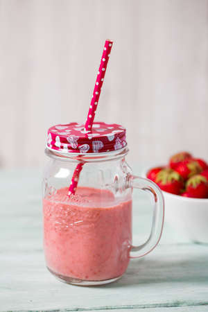 strawberry milk shake on wooden surfaceの写真素材