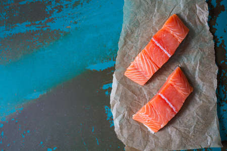 salmon on turquoise surfaceの写真素材