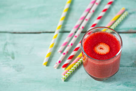 strawberry smoothie on wooden surfaceの写真素材
