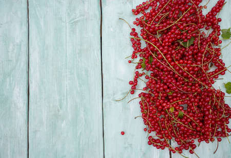 red currant on wooden surfaceの写真素材
