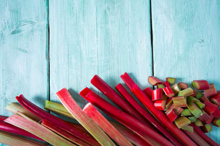 rhubarb stems on wooden surface
