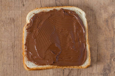 chocolate cream spread over white bread