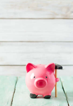 piggy bank on wooden surfaceの写真素材