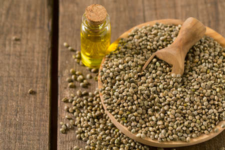 Hemp seed oil on wooden surfaceの写真素材