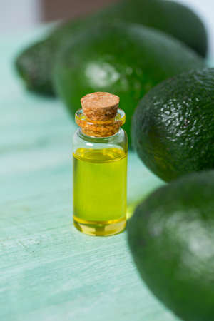 avocado oil on wooden surfaceの写真素材