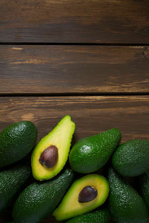 avocado on dark wooden surface