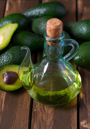 avocado oil on wooden surfaceの写真素材