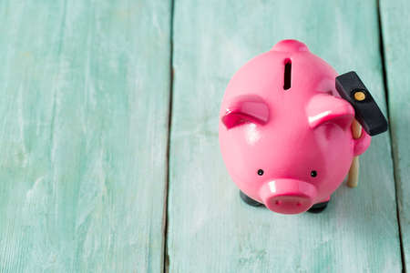 Piggy bank on wooden surface
