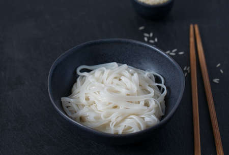 Rice noodles in a black bowl