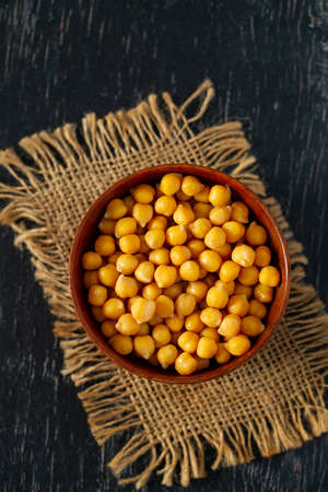 chickpeas on wooden surfaceの写真素材