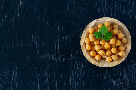 chickpeas on wooden surfaceの写真素材