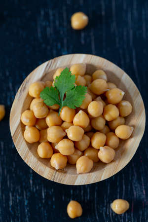 chickpeas on wooden surfaceの写真素材