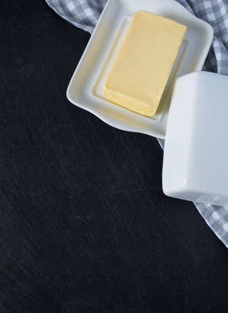 butter on black stone surfaceの写真素材