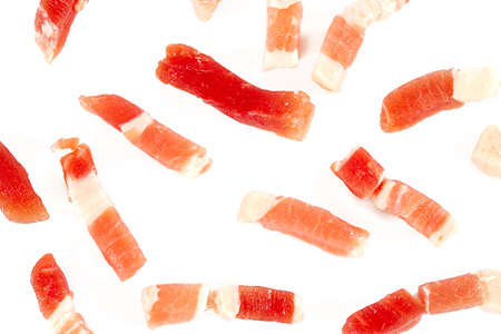bacon cubes isolated on white backgroundの写真素材