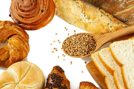 fresh bread and grains in a bowl isolated on white