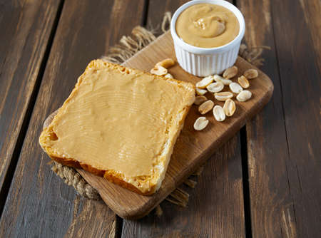 Peanut butter sandwich on wooden surface