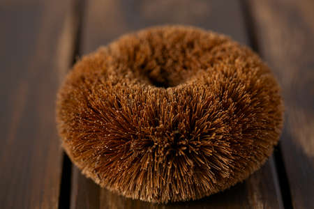 coconut brush on brown wooden surface
