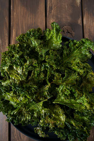 kale chips on wooden surface