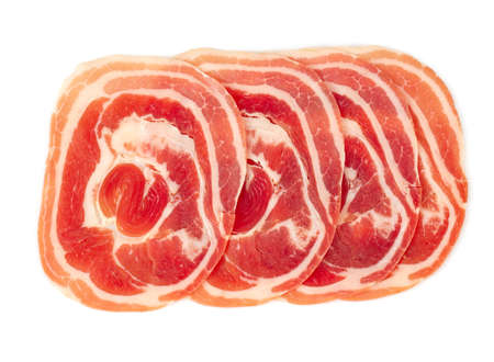 Close up of italian pancetta bacon isolatedの写真素材