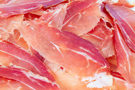 Spanish jamon serrano isolated on white