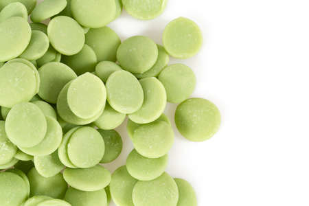 lime chocolate chips isolated on whiteの写真素材