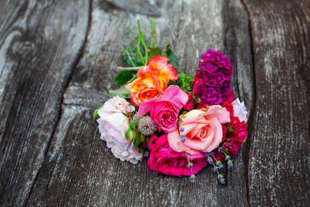 boquet of roses on old wooden surfaceの写真素材