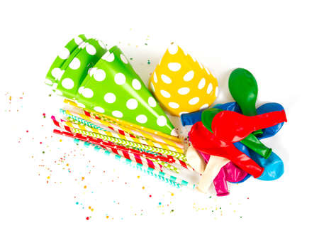 Party hats and paper straws isolated on whiteの写真素材