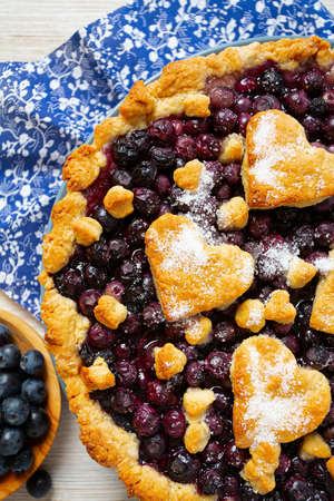 homemade blueberry pie on white wooden surfaceの写真素材
