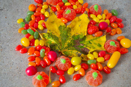 autumn color candies on granite surfaceの写真素材