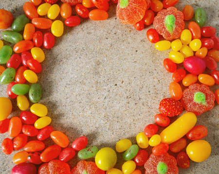 autumn color candies on granite surfaceの写真素材