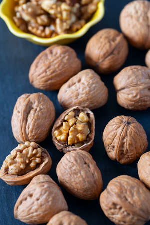 walnuts on black stone surface