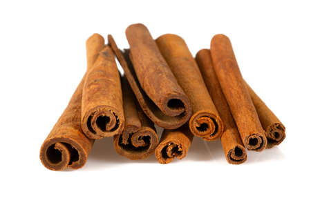 cinnamon sticks isolated on white backgroundの写真素材