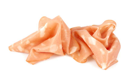 thin slices of mortadella ham isolated on whiteの写真素材