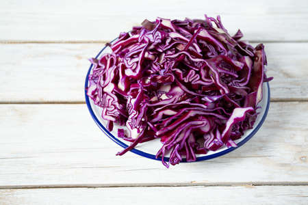 red cabbage on white wooden surfaceの写真素材