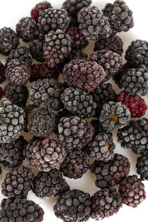 frozen blackberries isolated on white