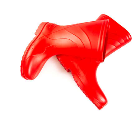 red rubber boots isolated on whiteの写真素材