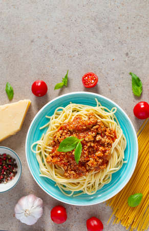 spaghetti bolognese on granite surfaceの写真素材