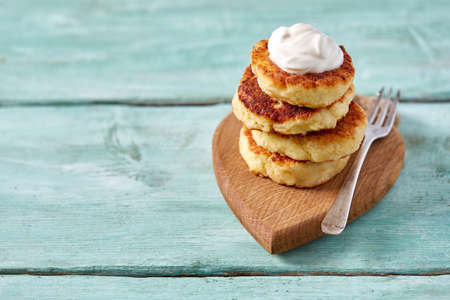 cottage cheese pancakes on wooden surface