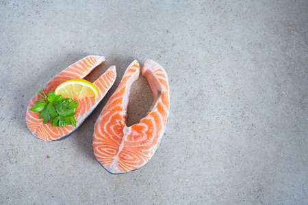 fresh salmon stake on granite surfaceの写真素材
